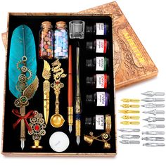 an open box with various items in it and some writing utensils next to it