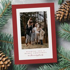 a family christmas card with pine cones