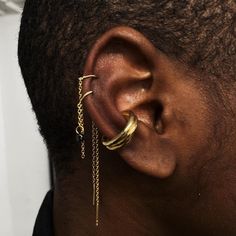 a close up of a person with ear piercings