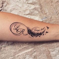 a woman's arm with a tattoo on it that says love and an arrow