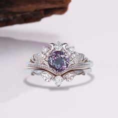 Gorgeous vintage inspired Alexandrite ring set ✧ Sterling Silver 925 ✧ Accented with natural quartz diamonds This gorgeous, timeless ring features a stunning alexandrite and natural crystals.  ✧ Shape: Round ✧ Color: Purple/maroon/purple (color changes in different lighting)  ✧ Center Stone: 5mm (approx.) ✧ Gemstone Origin: Brazil ✧ Sizes 3.75-14.25 ✧ This ring set will arrive ready to gift in a Kherish Box. ✧ Due to the nature of the handmade process, each piece may slightly vary in color, size Alexandrite Necklace, Pave Heart Necklace, Rutilated Quartz Necklace, Maroon Purple, Black Gold Ring, Timeless Ring, Silver Engagement Ring, Engagement Ring For Women, Sterling Silver Rings Set