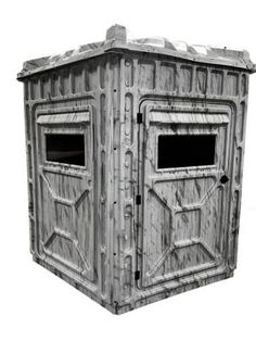 an outhouse with two windows and no roof