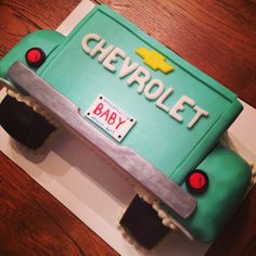 a cake made to look like a car with the word chevrolet on it's side