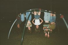 some people are hanging upside down in the dark