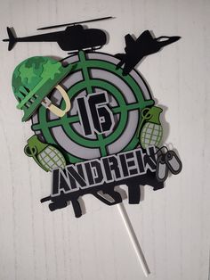 a clock with an army helmet on it and the words'16 and green '