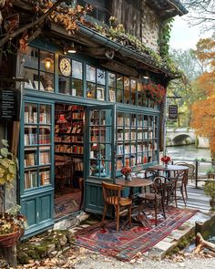 a book store with tables and chairs in front of it