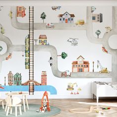 a child's room with a mural on the wall and toys in the floor