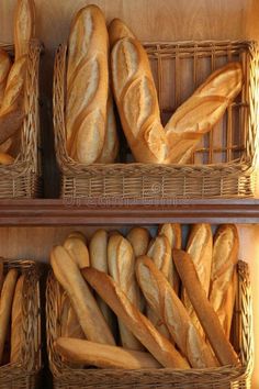 breads in wicker baskets on wooden shelves