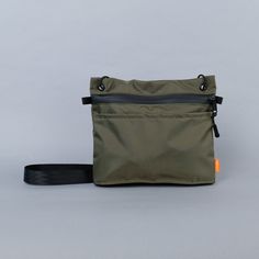 A minimalist’s dream bag. The Wayland Sacoche sits tight to the body but holds a lot for its size. Two reach-in pockets on either side will hold small items for quick-release. An inside sleeve (with a 70/30 split) will keep your pens and your phone separate from the rest, and safe from the click-click-click noise of a Functional Shoulder Bag With Zipper Pocket For On-the-go, Functional Rectangular Shoulder Bag For Outdoor, Functional On-the-go Shoulder Pouch, On-the-go Shoulder Bag With Zipper Pocket, Modern Everyday Pouch With Zipper Pocket, Green Multifunctional Shoulder Bag With Zipper Pocket, Functional Pouch With Zipper Pocket For Everyday, Functional Everyday Pouch With Zipper Pocket, Travel Shoulder Pouch With Zipper Pocket