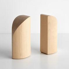 two pieces of wood sitting next to each other