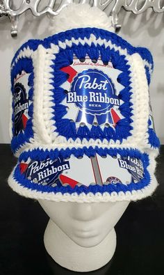 a hat made to look like it has blue ribbon around the brim and white trim