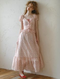 This product is a polka-dot dress adorned with delicate ruffles and bows, offering a romantic and feminine aesthetic. The dress features a flattering sweetheart neckline and a tiered ruffle skirt that enhances its whimsical charm. It is crafted from a lightweight fabric that ensures both comfort and a graceful drape. - This dress showcases a polka-dot pattern paired with ruffled detailing, creating a charming and playful look.- It is designed with a sweetheart neckline that adds a touch of elegance and flattery to the silhouette.- The tiered ruffle skirt not only adds volume but also allows for fluid movement, perfect for a variety of occasions.- Constructed from a lightweight fabric, the dress remains comfortable and breathable throughout the day, making it ideal for spring and summe Pink Midi Dress With Sweetheart Neckline And Ruffles, Sweet Floral Print Square Neck Dress, Sweet Square Neck Floral Print Dress, Sweet Square Neck Floral Dress, Summer Polka Dot Dress With Sweetheart Neckline, Cute Polka Dot Dress With Ruffles, Swiss Dot Dress For Garden Party, Sweet Summer Dress With Sweetheart Neckline, Spring Dress With Sweetheart Neckline And Bow