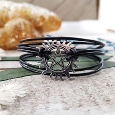 "Protect yourself with a supernatural bracelet. Adorned with an anti possession pentacle and layers of black leather or faux vegan leather. They close with a strong magnetic clasp for easy on and off -but security knowing it will stay put. Those that hunt together, stay together. Keep those evil spirits from inhabiting your body. Makes a perfect gift for your friendly fellow ghost hunters. - Silver tone Anti-possession charm - Made to order in your perfect size 6-9\" inches - Genuine leather OR Supernatural Shoes, Supernatural Bracelet, Protection Sigil, Supernatural Anti Possession, Supernatural Jewelry, Pentacle Jewelry, Supernatural Outfits, Half Pint, Ghost Hunters