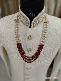 Groom's Necklace This is a must have accessory for the groom in the wedding. The necklace worn over the sherwani gives the groom an excellent look and it is a tradition.                                                                                                                                      Necklace (comes with adjustable Dori/cord) Package: 1 Necklace Material: Pearl & stone beads Care: Store in an airtight plastic bag or box. Keep away from water, moist place & fragrance White Festive Necklace For Marriage, Festive White Necklace For Marriage, Festive White Wedding Necklace, Traditional White Kundan Necklace For Marriage, Traditional White Necklace For Marriage, White Temple Jewelry Mala For Weddings, Traditional White Wedding Mala, Groom Wedding Jewellery, Groom Jewellery