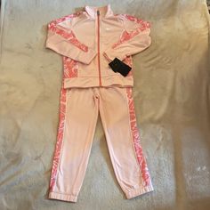 Nike Girls Tracksuit Size 6. Pink In Color. Brand New! Nike Fitted Sports Sets, Fitted Nike Sports Sets, Nike Fitted Sportswear Sets, Nike Pink Playwear Sets, Toddler Nike Outfits, Nike Girl Outfits, Boys Nike Outfits, Girls Nike Outfits, Cute Pink Outfits