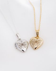 Material 14K Solid Gold, Gold Filled, Sterling Silver Production Time 3-7 Business Days Chain Delicate 1mm cable chain Locket Size Mini: 16.5mm X 11.5mmClassic: 20mm x 14.5mm Photo Size Mini: 8mm x 7.5mm (glue required to add photos)Classic: 10mm x 9.5mm (clear inserts included) Cosmic Butterfly, Butterfly Locket, Photo Chain, Chain Locket, Butterfly Heart, Fine Gold Jewelry, Gold Girl, Heart Locket Necklace, Gold Locket