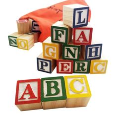 wooden blocks with letters spelling out the word abc