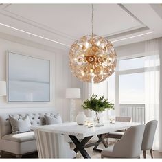 a dining room table with chairs and a chandelier hanging from it's ceiling