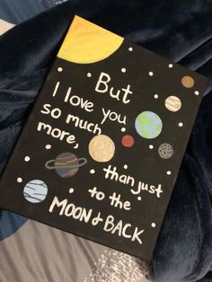 a book that is laying on top of a bed with the words, i love you so much more than just to the moon and back