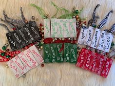 several christmas tags are laid out on a fur surface