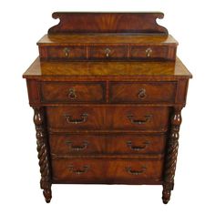 an old wooden dresser with drawers and knobs on the bottom drawer, against a white background