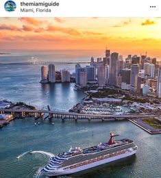 a cruise ship is in the water next to a large city with tall buildings on both sides