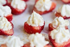 strawberries and whipped cream are arranged on a plate