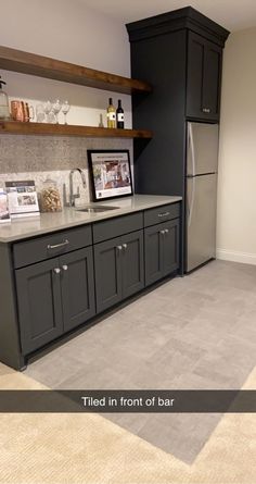 a kitchen with gray cabinets and white counter tops, is shown in this rendering image