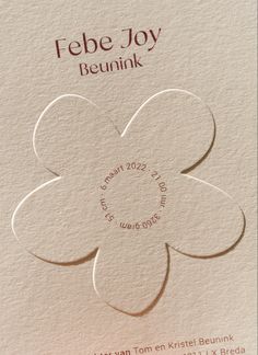 the back side of a paper with a flower cut out of it's center