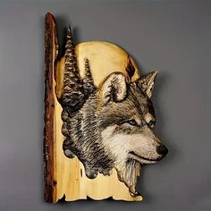 a wood carving of a wolf on a wall