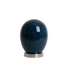 a blue ceramic vase with stars on it