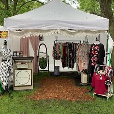 a tent with clothes hanging from it's sides