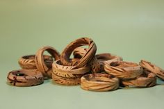 a pile of wooden rings sitting on top of a table