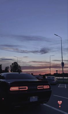 a car parked in a parking lot at dusk