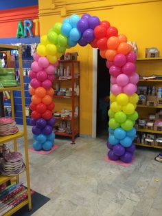 an arch made out of balloons in a store