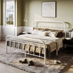 a white metal bed frame in a bedroom