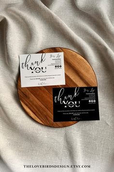 a wooden plate with a thank card on it