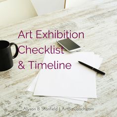 an art exhibition checklist and timeline on a table with a coffee cup, cell phone, pen and paper