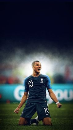 a man sitting on top of a soccer field