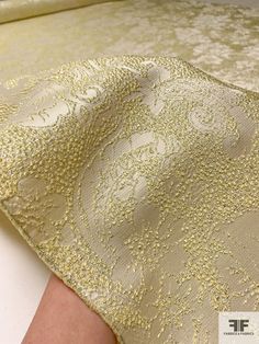 This floral textured metallic brocade in light yellow, silver, and champagne is a luxurious and opulent fabric that is perfect for creating a show-stopping look. The light yellow color combined with the metallic silver and champagne threads creates a subtle and sophisticated shimmer, while the floral pattern adds a touch of romance. SKU: 16509 Content: Polyester / Lurex Color: Light Yellow / Silver / Champagne Width: 51 inches