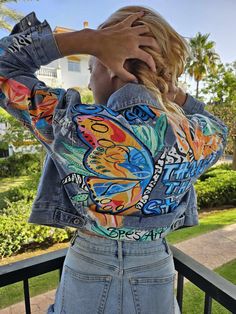 Make a bold statement with this one-of-a-kind handpainted denim jacket, featuring a vibrant butterfly design inspired by pop art. Each jacket is carefully crafted with bold, striking colors that bring the beauty of butterflies to life in a modern, artistic style. This piece is perfect for anyone who loves to stand out and express their unique sense of style. Material: 100% denim Design: Handpainted butterfly with vivid pop art colors Fit: Relaxed, comfortable fit for everyday wear or special occasions Care: Hand wash or spot clean to preserve the handpainted design Customization: Available in various sizes; custom colors and designs available upon request Whether you pair it with jeans for a casual day out or layer it over a dress for a chic look, this jacket will turn heads wherever you g Spring Blue Outerwear With Graffiti Print, Artistic Long Sleeve Denim Jacket For Spring, Multicolor Graphic Print Denim Jacket For Spring, Fitted Graffiti Print Outerwear For Spring, Artistic Blue Denim Jacket For Spring, Artistic Fitted Denim Jacket For Spring, Hand Painted Blue Outerwear For Spring, Blue Hand Painted Outerwear For Spring, Hand Painted Blue Spring Outerwear