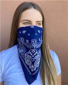 a woman with long hair wearing a bandana