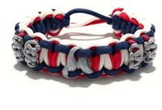 a red, white and blue bracelet with silver beads