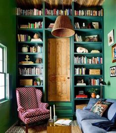 a living room filled with furniture and bookshelves