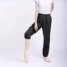 Discover Unmatched Comfort & Versatility Introducing our Women's Multi-Purpose Ballet-Inspired Fitness Pants, meticulously designed for the modern, active woman. Whether you're a dancer, yogi, runner, or just seeking comfort in your daily activities, these pants are the epitome of flexibility and style. Crafted from high-quality polyester and featuring a convenient elastic waist, they offer a seamless blend of comfort and durability. Product Features Elastic Waist Closure: Ensures a snug, adjustable fit for all body types. Premium Polyester Material: Provides durability and stretch for extensive movement. Versatile Design: Ideal for ballet, yoga, running, and any fitness activity. Origin: Proudly designed in Guangdong, synonymous with high-quality textile production. When and Where to Wear Micro-elastic Long Training Bottoms, Micro-elastic Training Pants, Black Bottoms With Elastic Waistband For Pilates, Black Comfort Stretch Sportswear Pants, Stretch Pants With Elastic Waistband For Training, Functional Pants With Elastic Waistband For Pilates, Black Micro-elastic Pants With Elastic Waistband, Full Length Elastic Gym Pants, Elastic Full-length Gym Pants