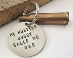 a keychain that says,'my hunting buddy calls me dad'on it