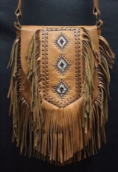 Leather Fringes Bag Hand Made Cross Body Bag Cowgirl Western Leather Ladies Bag , Boho fringe purse. Ladies leather western fringes bags and purses are stylish and trendy accessories that add a touch of Western flair to any outfit. These bags are made with high-quality leather and feature decorative fringes, giving them a unique and eye-catching look. They come in various sizes and styles, from crossbody bags to shoulder bags, and are perfect for adding a boho-chic vibe to your ensemble. So whether you're heading to a music festival or just want to add some Western charm to your everyday look, these bags are a must-have. Bone bead choker attached as decoration Fully lined inside with one pocket. Strap can be adjusted to several lengths. Material: leather, cow bones Available colors: Tan,br Brown Fringe Pouch Shoulder Bag, Brown Fringe Pouch Bag, Brown Rectangular Bag With Fringe, Painted Leather Purse, Western Bags, Western Bag, Leather Fringe Bag, Fringe Vest, Ladies Bag