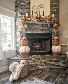 a living room filled with furniture and a fire place in front of a stone fireplace