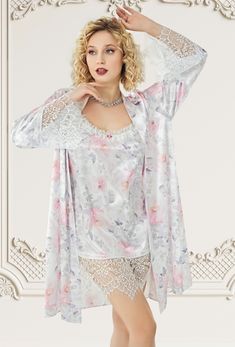 Embrace elegance with our stunning floral satin nightgown and robe set, adorned with delicate lace details. Perfect for special nights and celebrations, this set features: Floral Satin Fabric:  Luxurious satin with a beautiful floral pattern, offering a soft and silky touch. Lace Detailing:  Intricate lace accents on both the nightgown and the robe add a romantic and sophisticated touch. Comfortable Fit:  The nightgown is designed for a relaxed fit, ensuring comfort and style. Chic and Versatile Satin Sets With Lace Trim For Wedding Night, Satin Lace Trim Sets For Wedding Night, Spring Satin Nightgown For Wedding Night, Spring Wedding Night Satin Nightgown, Spring Wedding Satin Sleepwear, Lace Sleepwear With Floral Print For Loungewear, Floral Lace Sleepwear, Lace Sleepwear With Floral Print, Feminine Floral Print Sleepwear For Wedding Night