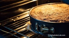 a cake is baking in an oven with the light shining on it's side